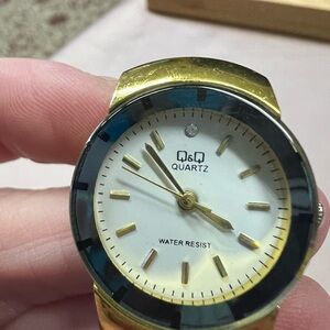 Gold Watch with Silver Bezel and Water Resistance